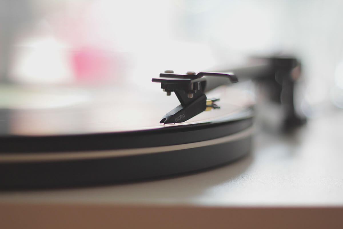 Close-up of a record player's needle on a vinyl record.