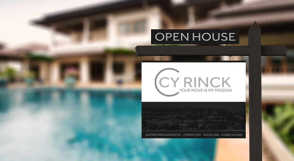Open house sign in front of a luxurious home with a pool.