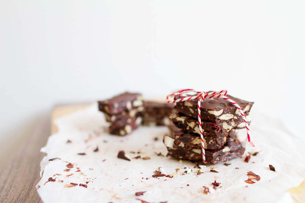 Stack of chocolate nut bars tied with red and white string.