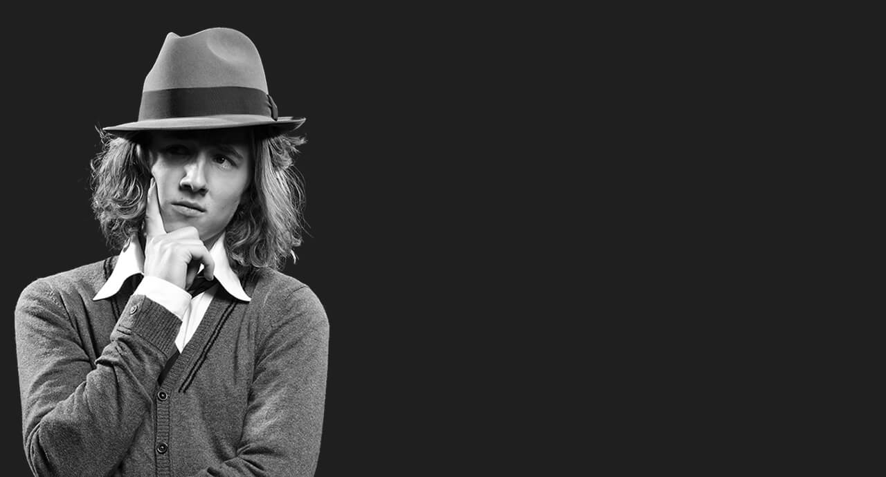 Person in hat thinking, monochrome image.
