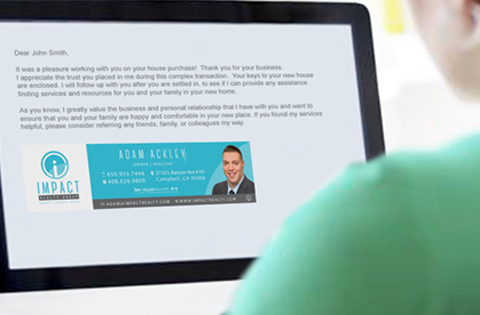 Person reading a professional email on a laptop screen.