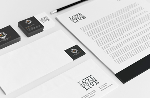 Elegant black and white branded stationery set with LOVE LIVE logo.