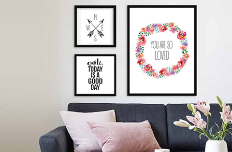 Cozy living room with inspirational wall art and floral accents.