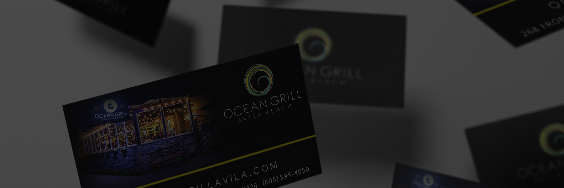 Business cards for Ocean Grille with a sleek black design.