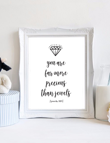 Wall art with a diamond and inspirational quote about being precious.