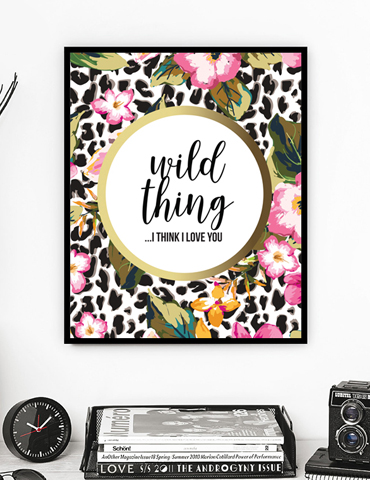 Framed floral and leopard print art with the phrase 'wild thing ...I think I love you'.
