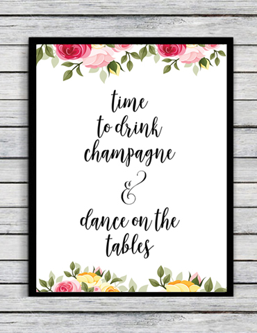 Inspirational sign encouraging champagne drinking and dancing on tables.